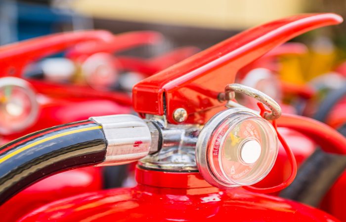 Red fire extinguishers available in fire emergencies.
[[** Note: Shallow depth of field
** Note: Visible grain at 100%, best at smaller sizes