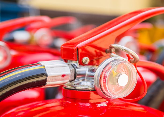 Red fire extinguishers available in fire emergencies.
[[** Note: Shallow depth of field
** Note: Visible grain at 100%, best at smaller sizes
